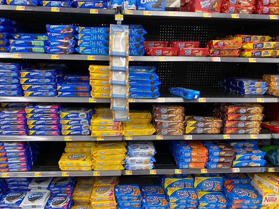 stacks of oreos and chips ahoy on shelves at a walmart