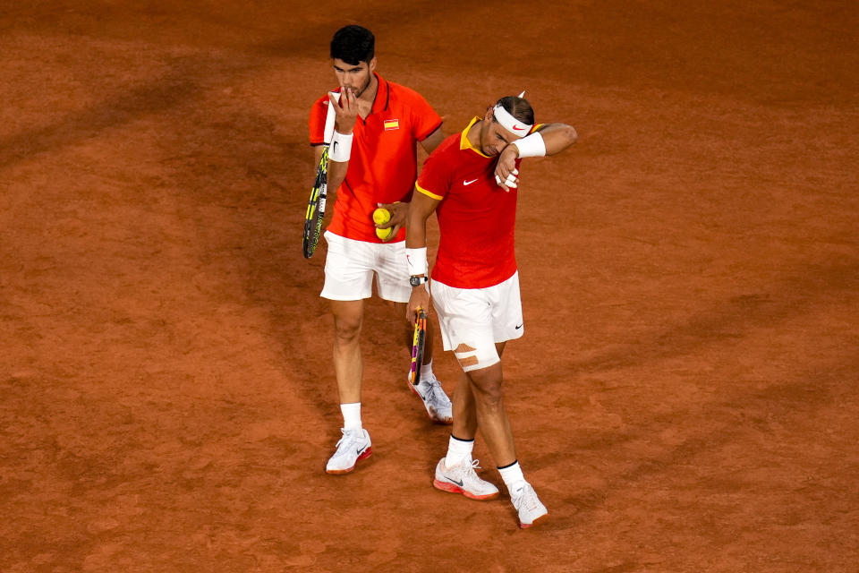 Tennis star Rafael Nadal walks on court to compete in singles at the