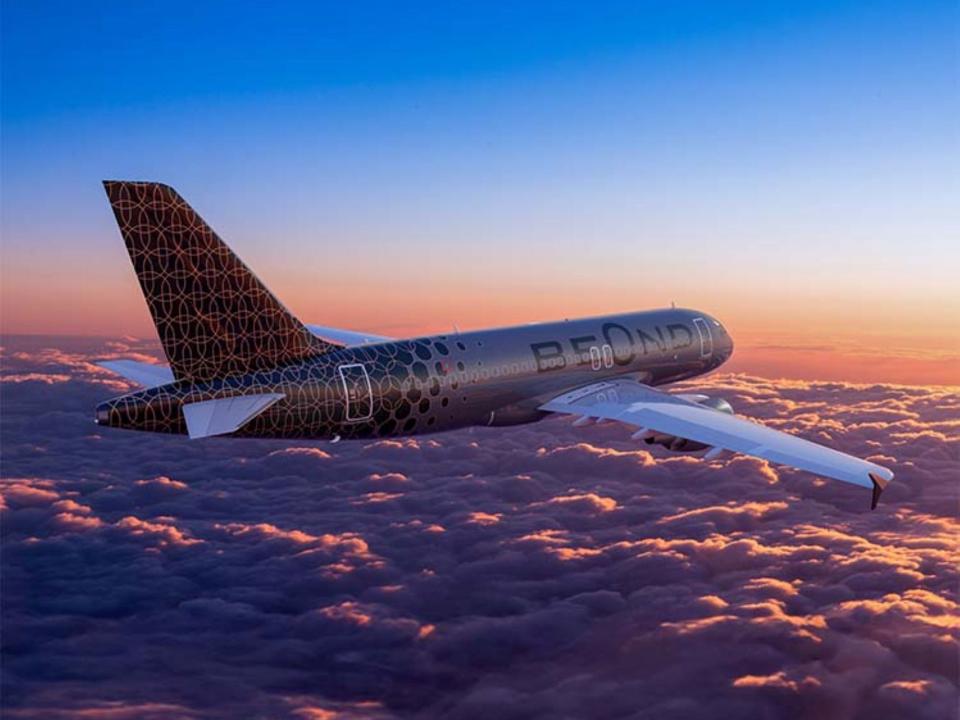 Rendering of a Beond aircraft flying over pink clouds.