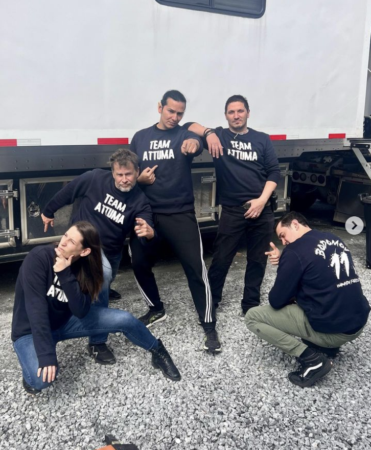 Alex Livinalli and crew members on the set of Wakanda Forever wearing Team Attuma sweatshirts