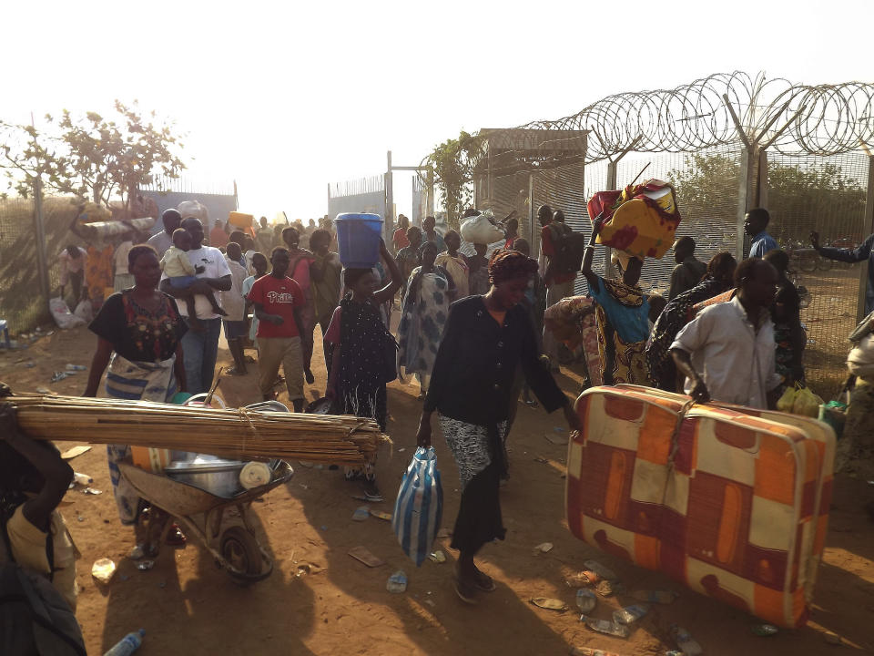 People arrive to seek refuge in the UNMISS compound in Juba, on December 18, 2013. (STR/AFP/Getty Images)