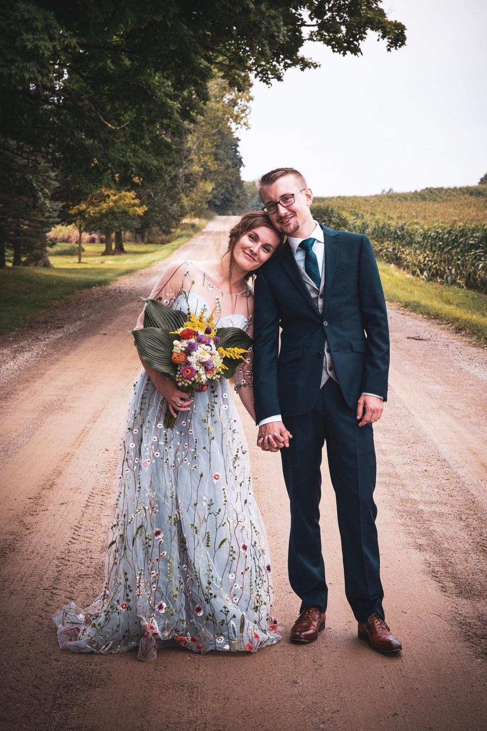 Customers praised the designer for this grey wedding gown. Image via Etsy.