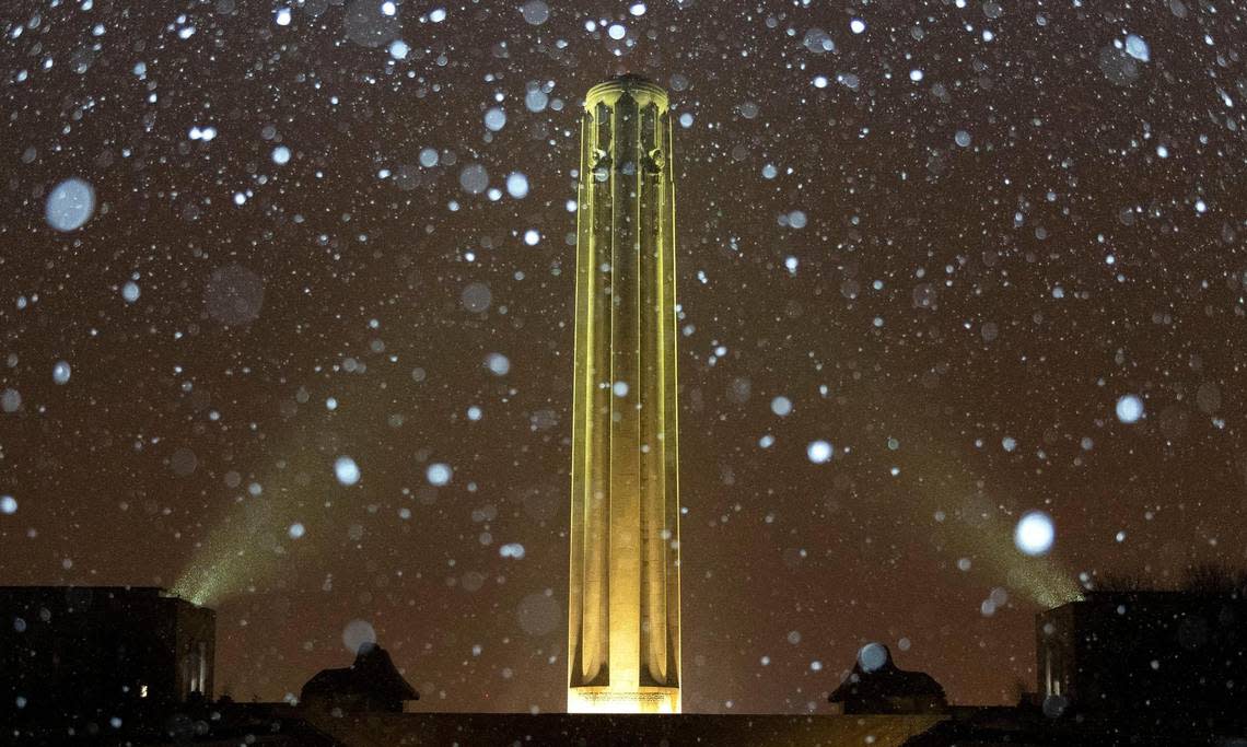 Snow falls on the Liberty Memorial Tower on Monday, Nov. 14, 2022 in Kansas City.