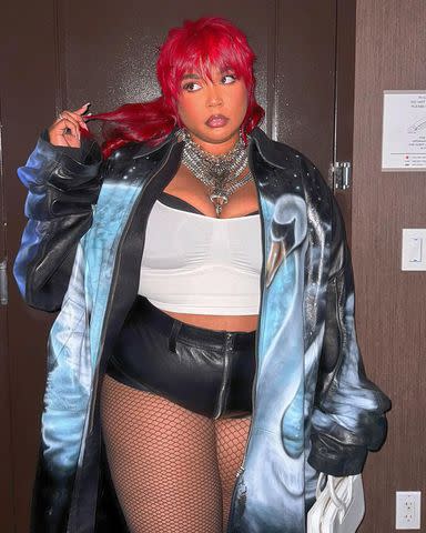 Lizzo displays her curves in a red sequinned leotard