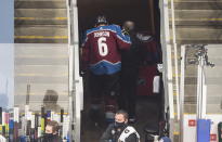 Colorado Avalanche's Erik Johnson heads off the ice with an injury during the first period against the Dallas Stars in Game 1 of an NHL hockey playoff second-round series, in Edmonton, Alberta, Saturday, Aug. 22, 2020. (Jason Franson/The Canadian Press via AP)