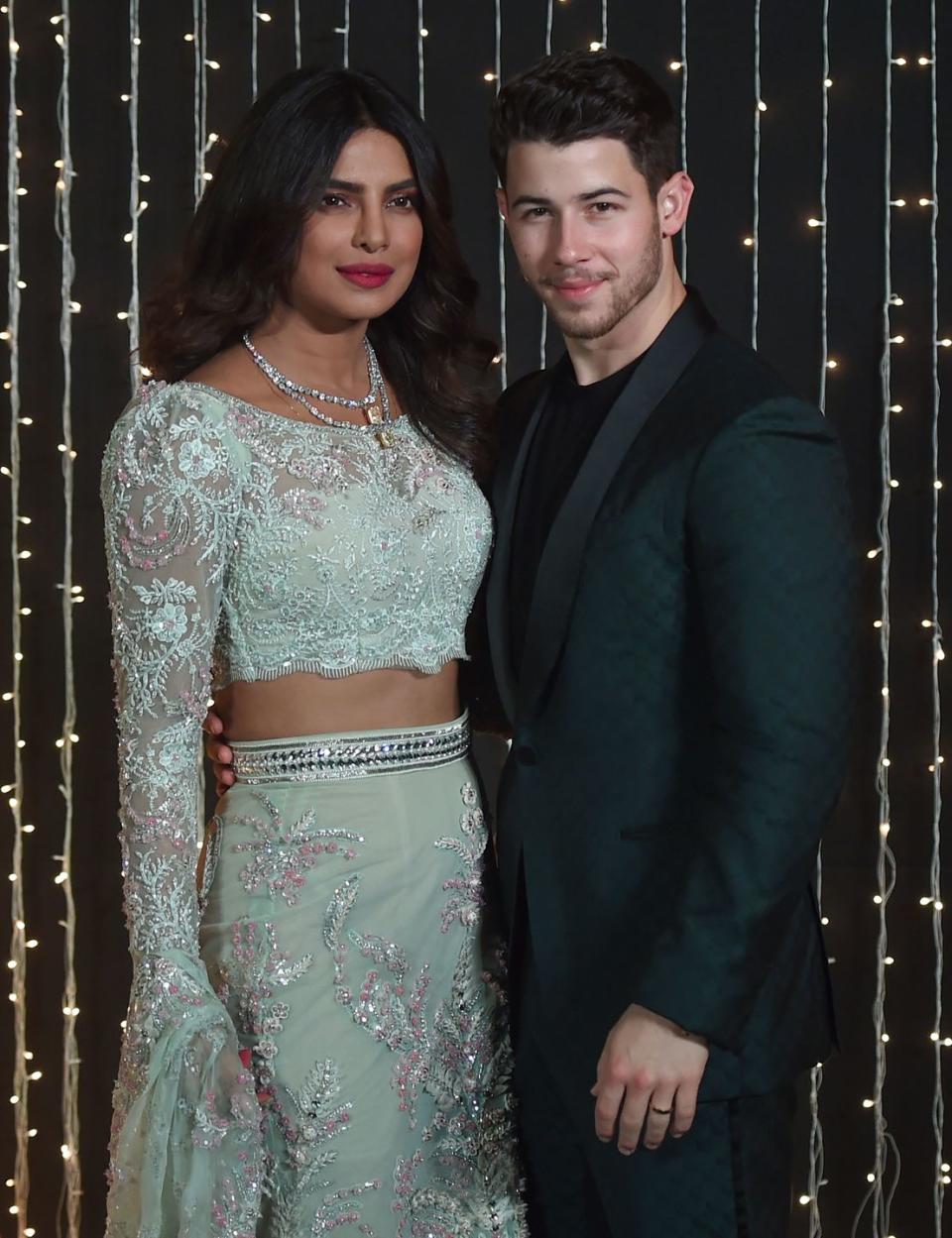 <p>The couple attend a reception in Mumbai, India a few weeks after they exchange vows.</p>