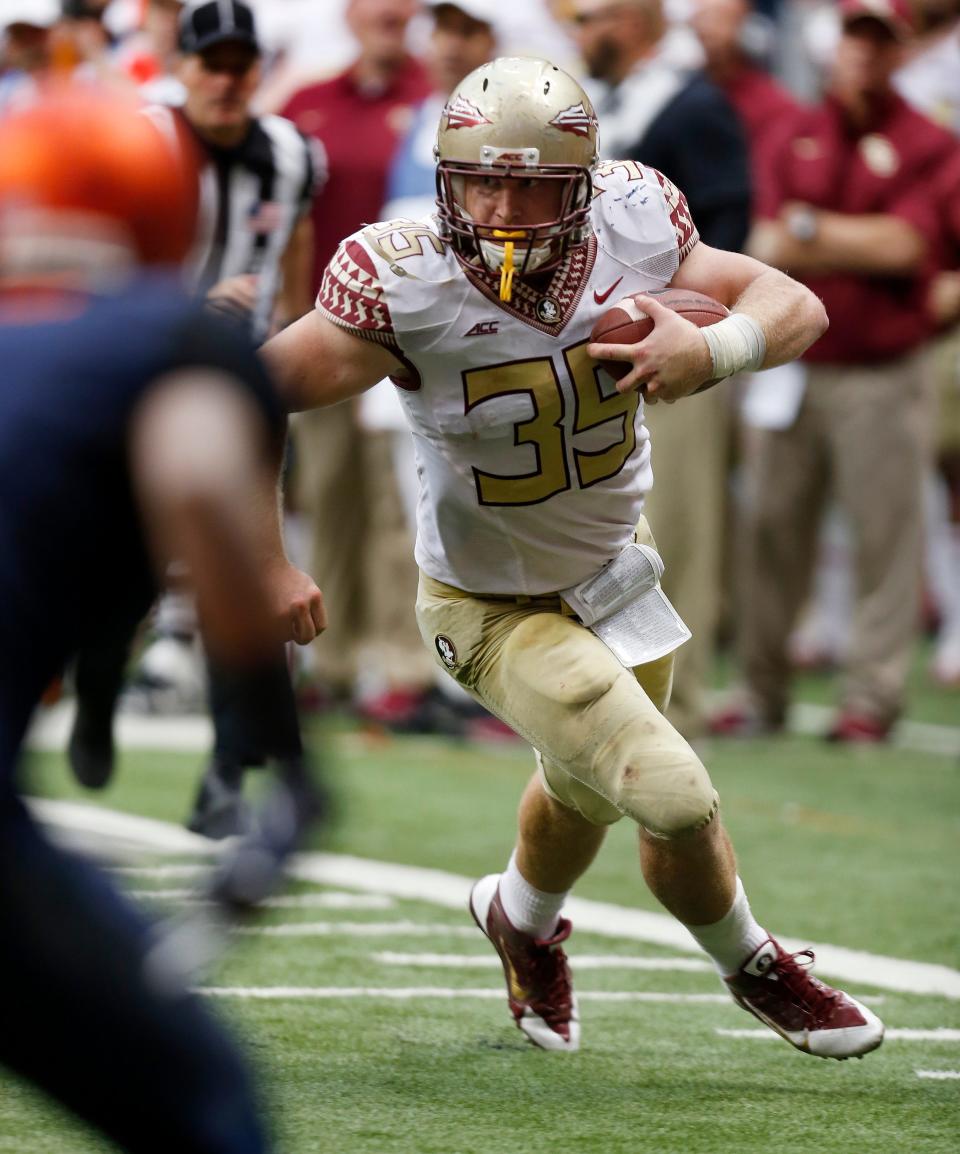 Nick O'Leary (35) takes first place as the No. 1 ranked Florida State Seminoles 38-20 cruise over the Syracuse Orange on Saturday, Oct. 11, 2014, at the Carrier Dome.