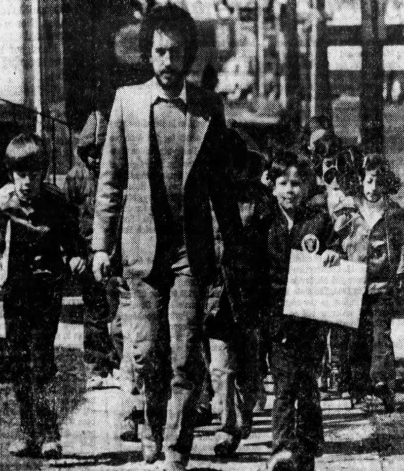 Andrew Mignano leads his first- and second-grade class from Irving School, Highland Park, to the post office on Thursday, April 2, 1981, to mail a big envelope full of get-well messages to President Ronald Reagan.