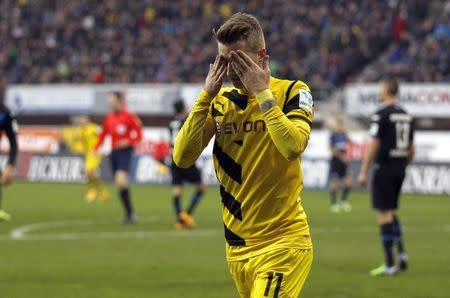 Borussia Dortmund's Marco Reus celebrates a goal against Paderborn during the Bundesliga first division soccer match in Paderborn November 22, 2014. REUTERS/Ina Fassbender