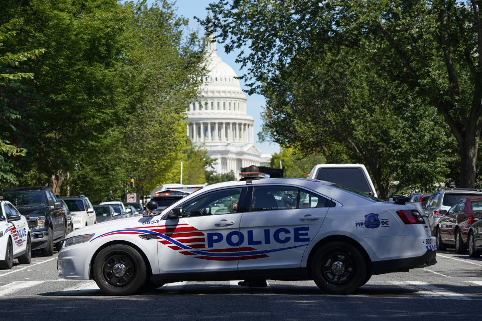 A police cruiser blocks a street near the U.S. Capitol during a bomb investigation Thursday. (AP Photo/Patrick Semansky)