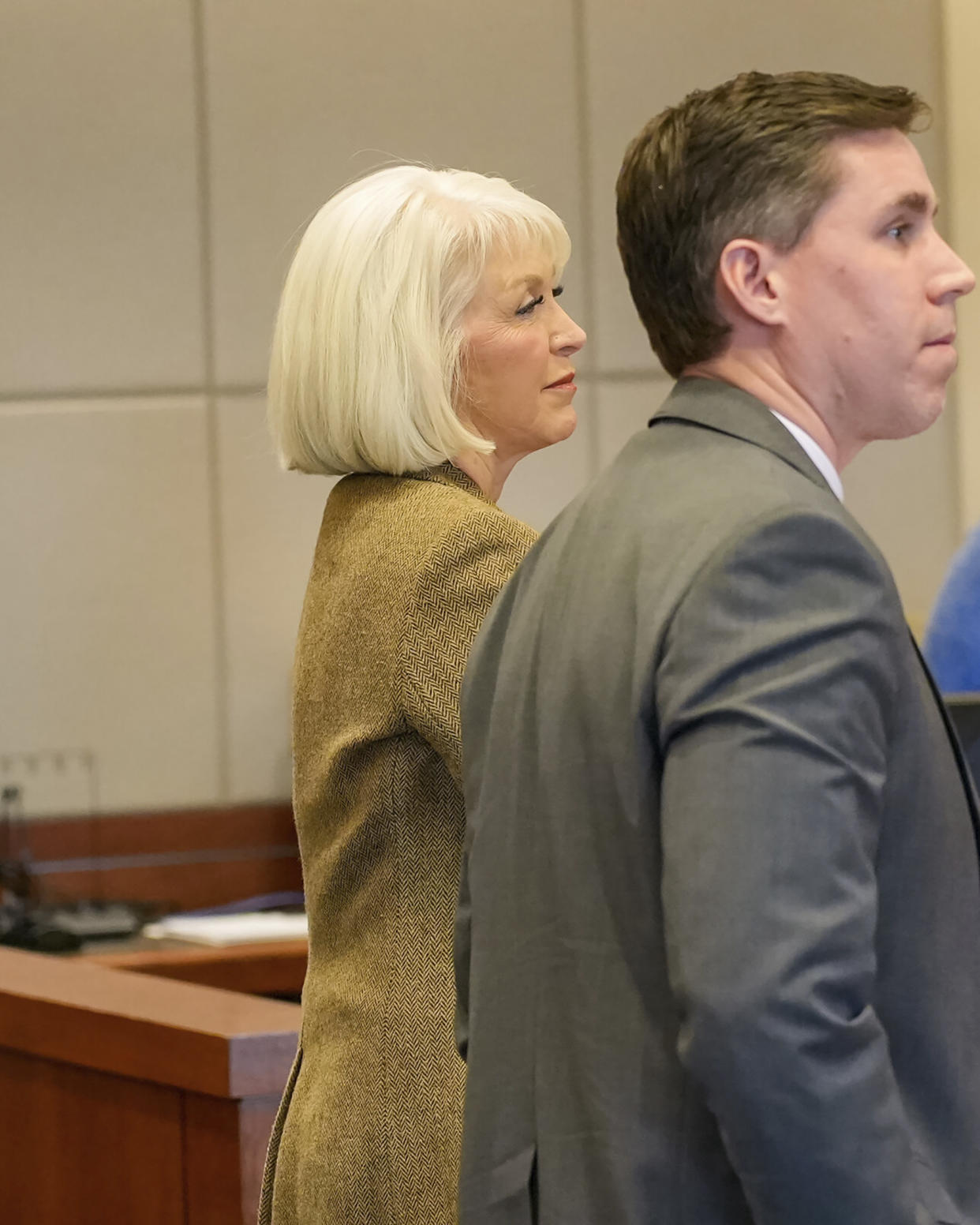 Former Mesa County, Colo., clerk Tina Peters, back, listens with lawyer Stephen Bernstein during Peters' trial Friday, March 3, 2023, in Grand Junction, Colo. Peters was convicted of a misdemeanor obstruction charge for refusing to turn over an iPad she allegedly used to videotape a court hearing. While jurors found Peters guilty of obstructing government operations, she was acquitted of obstructing a peace officer. The case is separate from Peters' alleged involvement in a security breach of voting machines. (Scott Crabtree/The Grand Junction Daily Sentinel via AP, Pool)