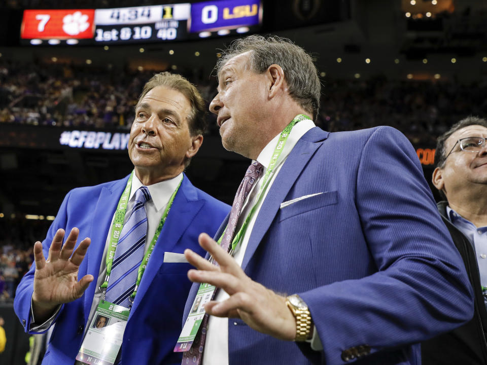 Nick Saban of the Alabama Crimson Tide and Jimbo Fisher of the Texas A&M Aggies talk on the sidelines during the CFP title game on Jan. 13, 2020. (Don Juan Moore/Getty Images)