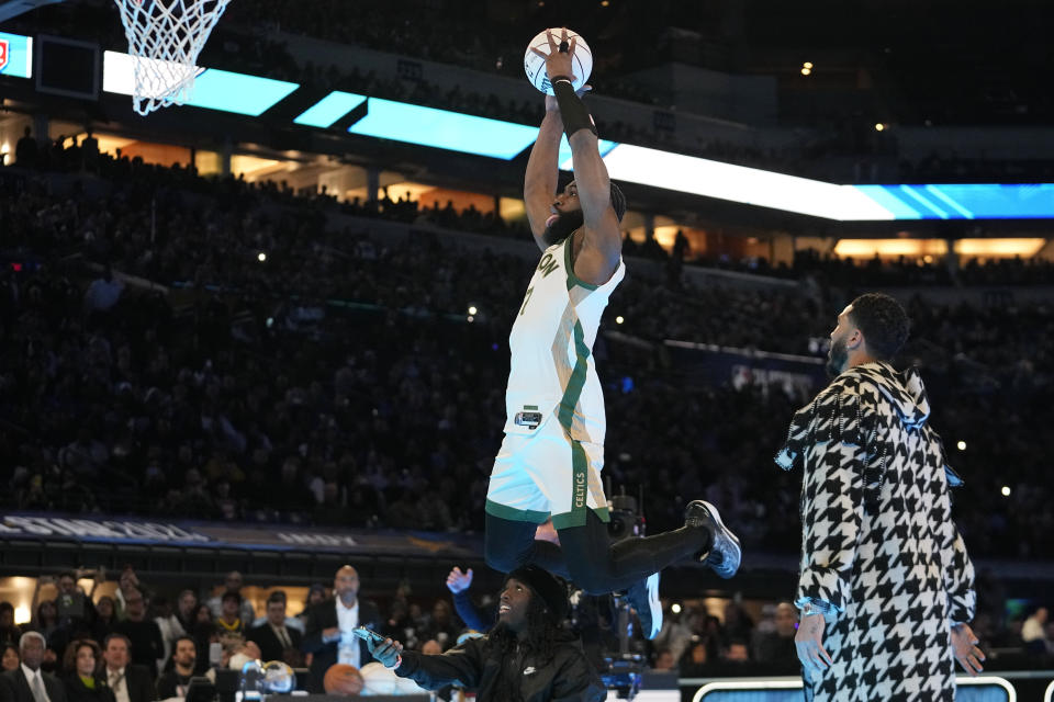 Boston Celtics' Jaylen Brown dunks during the slam dunk competition at the NBA basketball All-Star weekend, Saturday, Feb. 17, 2024, in Indianapolis. (AP Photo/Darron Cummings)