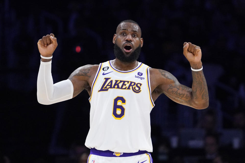 Los Angeles Lakers forward LeBron James gestures to teammates during the first half of an NBA basketball game against the Utah Jazz Sunday, April 9, 2023, in Los Angeles. (AP Photo/Mark J. Terrill)