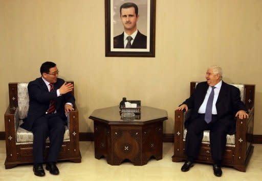 Syrian Foreign Minister Walid al-Muallem (R) meets with Chinese Envoy Lee Huaxin in Damascus. Muallem said that Damascus was ready to cooperate with a Chinese initiative to end the bloodshed and begin dialogue between the regime and the opposition