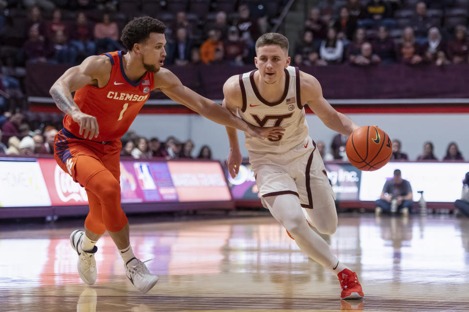 Virginia Tech's Sean Pedulla drives by Clemson's Chase Hunter during the first half of an NCAA college basketball game Wednesday, Jan. 10, 2024, in Blacksburg, Va. (AP Photo/Robert Simmons)