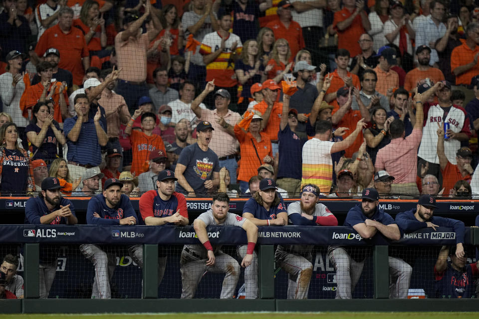 The Boston Red Sox watch during the ninth inning in Game 1 of baseball's American League Championship Series against the Houston Astros Friday, Oct. 15, 2021, in Houston. (AP Photo/David J. Phillip)