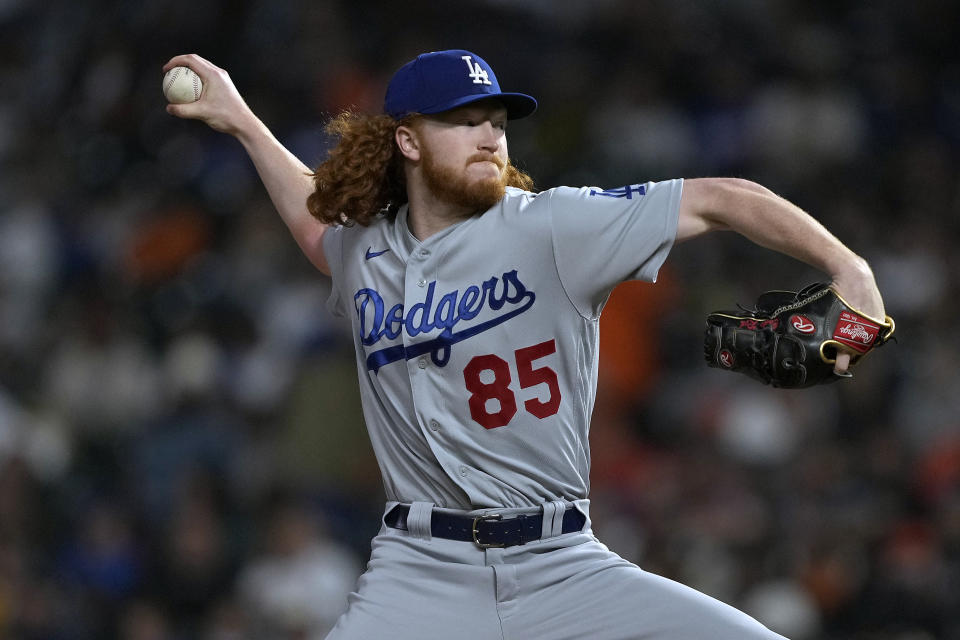 Los Angeles Dodgers pitcher Dustin May throws to a San Francisco Giants batter during the first inning of a baseball game Friday, Sept. 16, 2022, in San Francisco. (AP Photo/Tony Avelar)