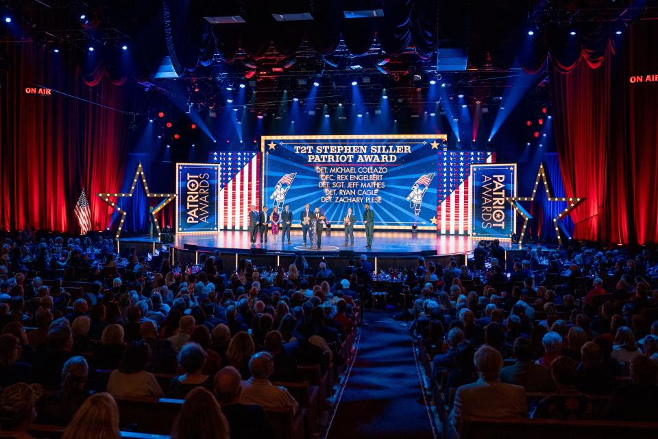 Metro Nashville Police officers who responded to the Covenant School shooting receive the T2T Stephen Siller Patriot Award during the Fox Nation Patriot Awards at Grand Ole Opry House in Nashville, Tenn., Thursday, Nov. 16, 2023.