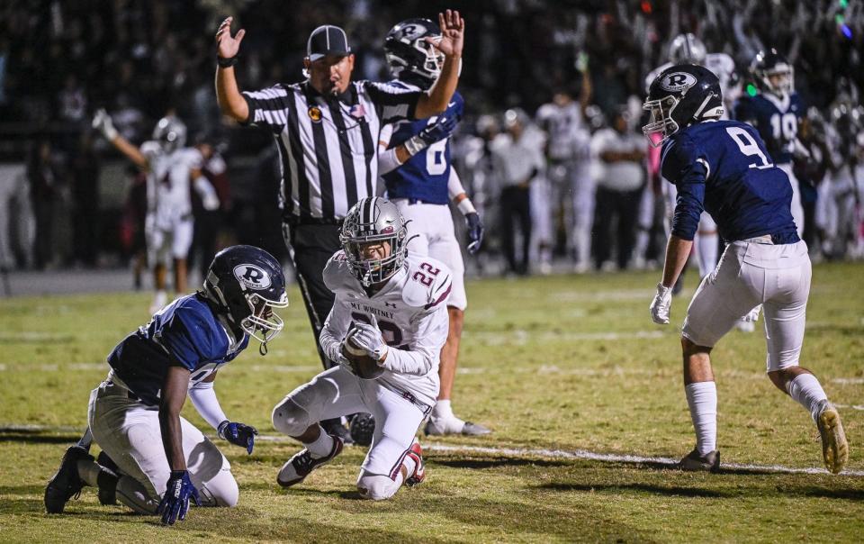 Mt. Whitney's Xavier Soto scores against Redwood in the 68th annual rivalry Cowhide game Friday, October 27, 2023.