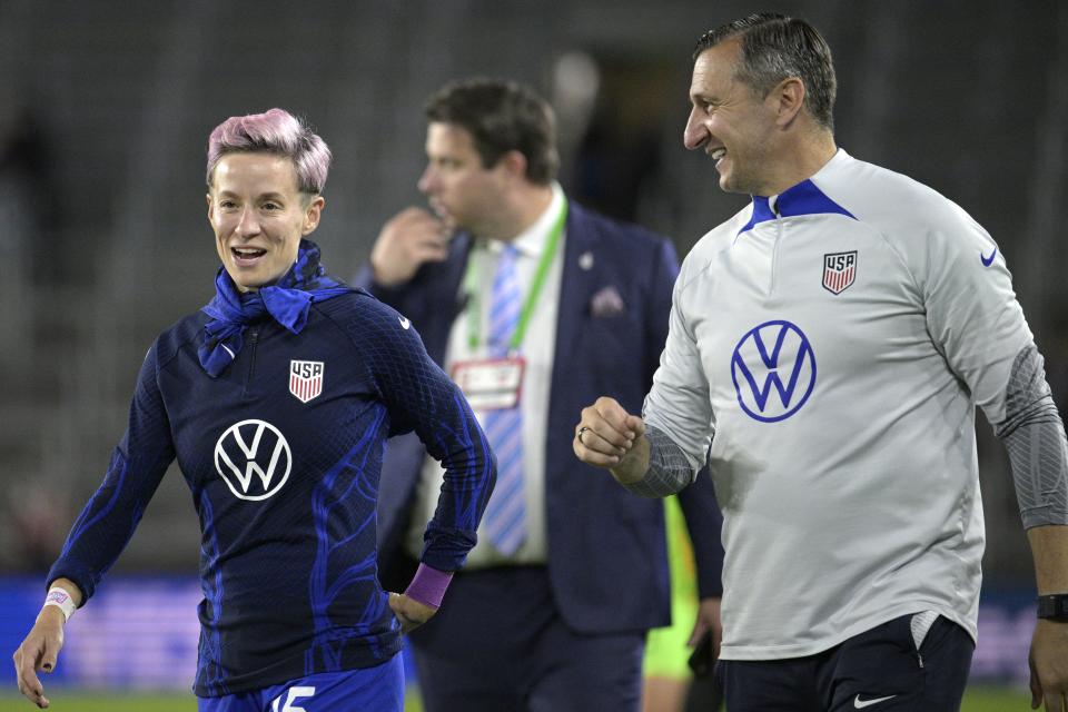 U.S. coach Vlatko Andonovski, right, and forward Megan Rapinoe (15) laugh after the team’s win against <a class="link " href="https://sports.yahoo.com/soccer/teams/canada-women/" data-i13n="sec:content-canvas;subsec:anchor_text;elm:context_link" data-ylk="slk:Canada;sec:content-canvas;subsec:anchor_text;elm:context_link;itc:0">Canada</a> during a SheBelieves Cup soccer match Thursday, Feb. 16, 2023, in Orlando, Fla. Rapinoe was one of the veterans selected Wednesday, June 21, 2023, for the United States team that will defend its title at the Women’s World Cup next month. | Phelan M. Ebenhack, Associated Press