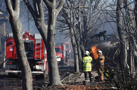Firefighters work on the site where a cargo train derailed and exploded in the village of Hitrino, Bulgaria, December 10, 2016. Impact Press Group/Petko Momchilov/via REUTERS ATTENTION EDITORS - THIS IMAGE HAS BEEN SUPPLIED BY A THIRD PARTY. THIS PICTURE IS DISTRIBUTED EXACTLY AS RECEIVED BY REUTERS, AS A SERVICE TO CLIENTS. FOR EDITORIAL USE ONLY. NO RESALES. NO ARCHIVES. - RTX2UE4N