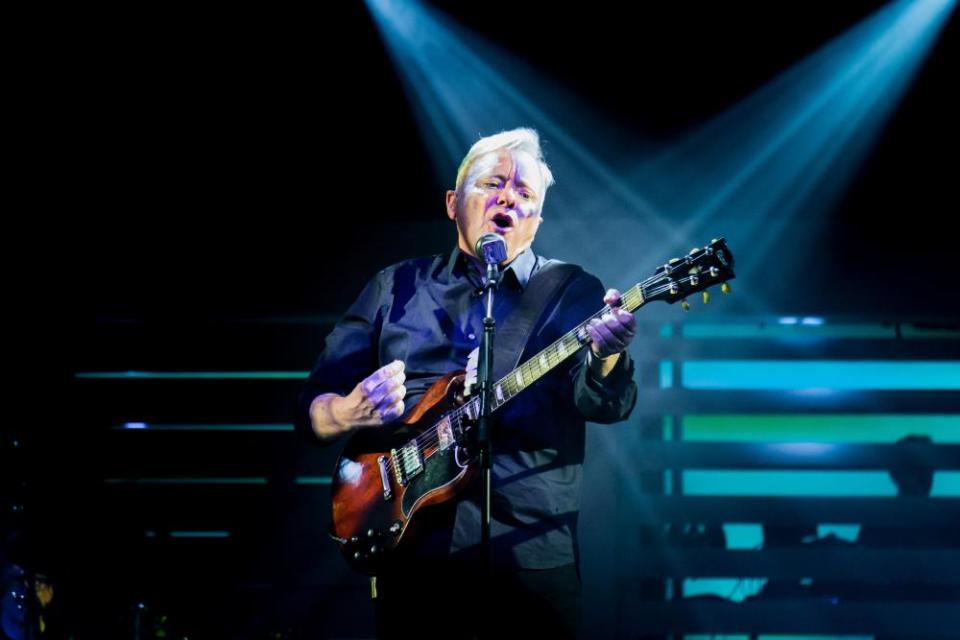 Bernard Sumner on stage in Torino in 2018.