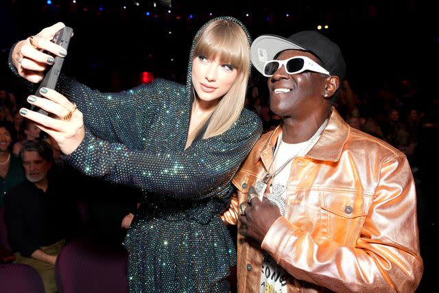 <p>Kevin Mazur/Getty</p> Taylor Swift and Flavor Flav