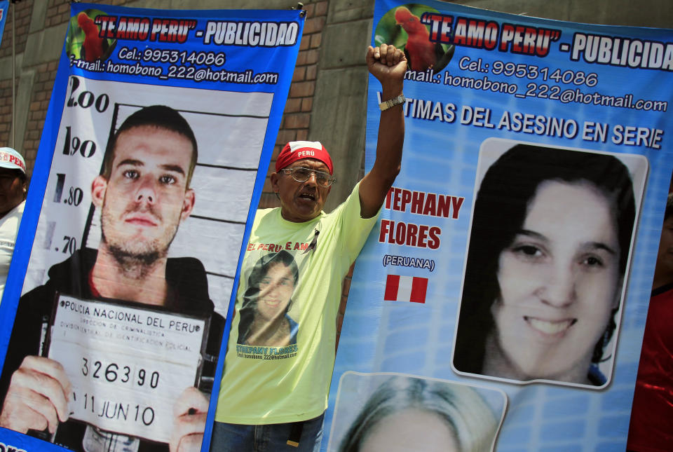 A man in Lima, Peru, holds posters of Dutch citizen Joran Van der Sloot and Peruvian girl Stephany Flores outside the Lurigancho prison, where van der Sloot was being read his sentence for murdering Flores in 2012. Van der Sloot was sentenced to 28 years in prison. (Photo: Pilar Olivares / Reuters)