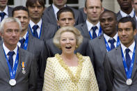 FILE- In this Tuesday, July 13, 2010 file photo, The Netherlands' World Cup team poses with Queen Beatrix, center, at Noordeinde Palace in The Hague, Netherlands, during a day of celebrations for the tournament runners-up. The Dutch Royal House says Queen Beatrix will deliver a nationally televised speech, on Monday, Jan. 28, 2013, and speculation is growing that the popular monarch will announce she is to abdicate. Beatrix, who turns 75 on Thursday, has ruled this nation of 16 million for more than 32 years and would be succeeded by her eldest son, Crown Prince Willem-Alexander. (AP Photo/Rob Keeris, File)