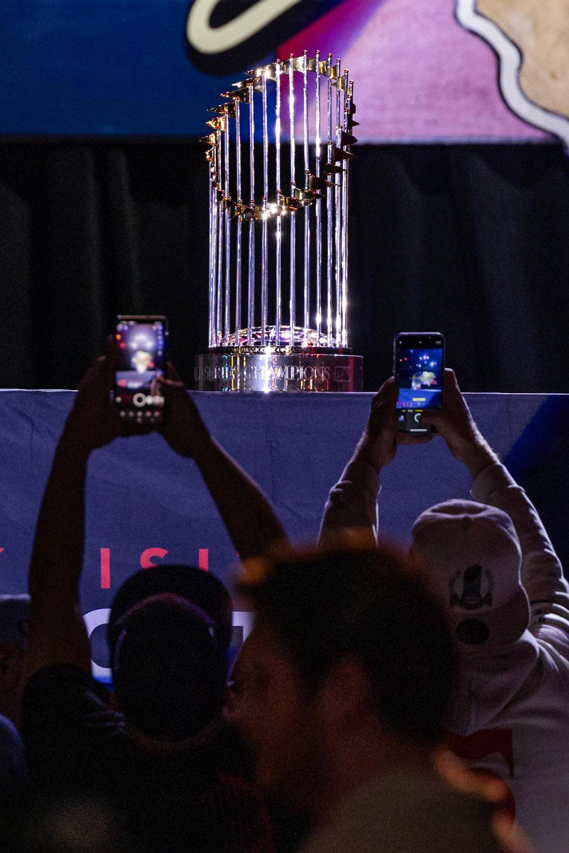 Fans take photos of the World Series Commissioners Trophy at the World Series celebration event at Billy Bob’s Texas in Fort Worth on Thursday, Nov. 9, 2023. Chris Torres/ctorres@star-telegram.com