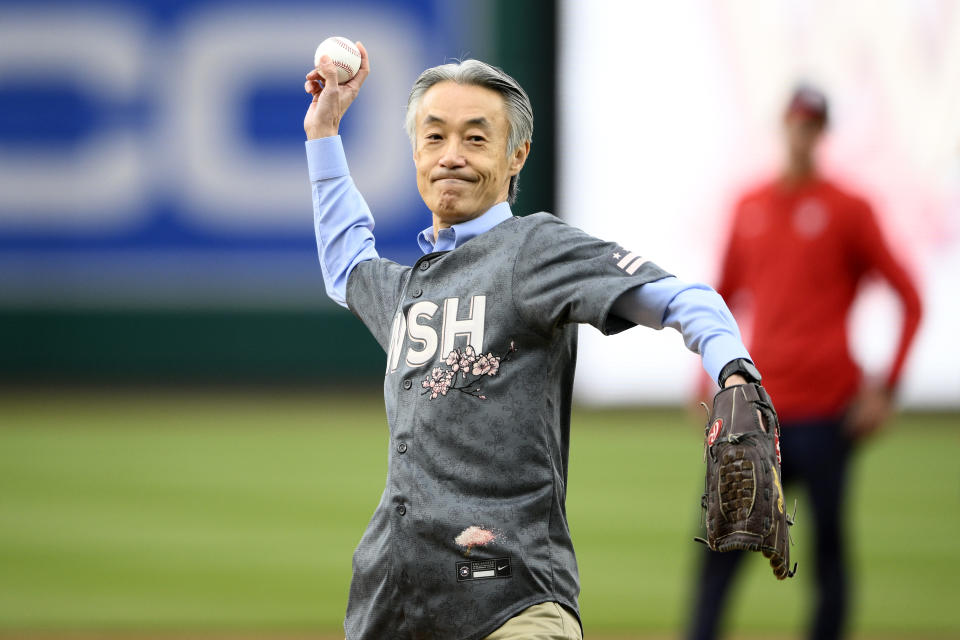 Shigeo Yamada, ambassador of Japan to the United States, throws out a ceremonial first pitch before a baseball game between the Washington Nationals and the Philadelphia Phillies, Saturday, April 6, 2024, in Washington. (AP Photo/Nick Wass)