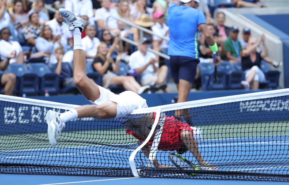 Oscar Otte (pictured) falls over the net while playing against Matteo Berrettini at the US Open.