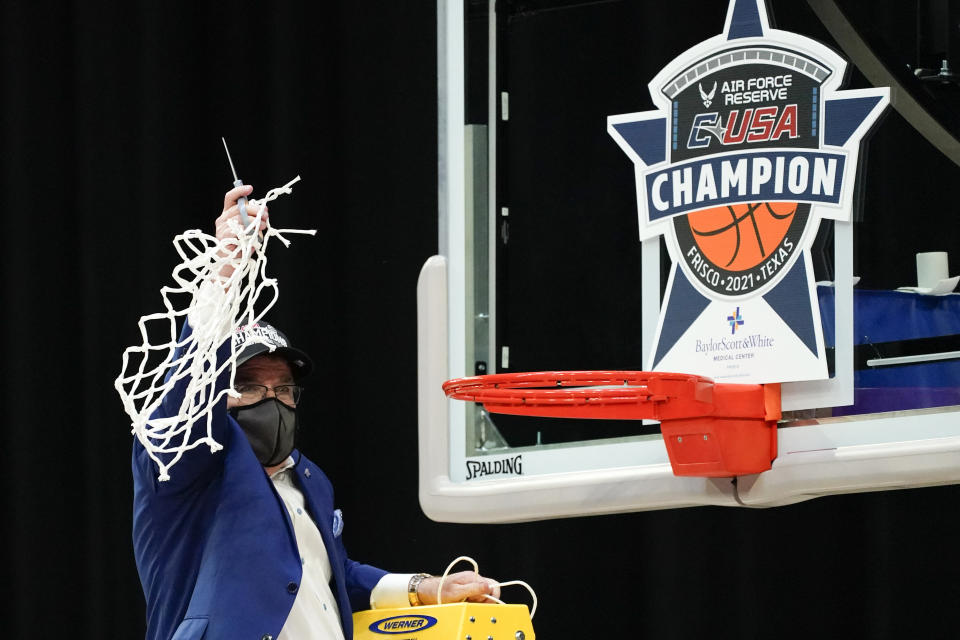 Middle Tennessee head coach Rick Insell celebrates after the championship game against Rice in the NCAA Conference USA women's basketball tournament Saturday, March 13, 2021, in Frisco, Texas. Middle Tennessee won 68-65. (AP Photo/Tony Gutierrez)