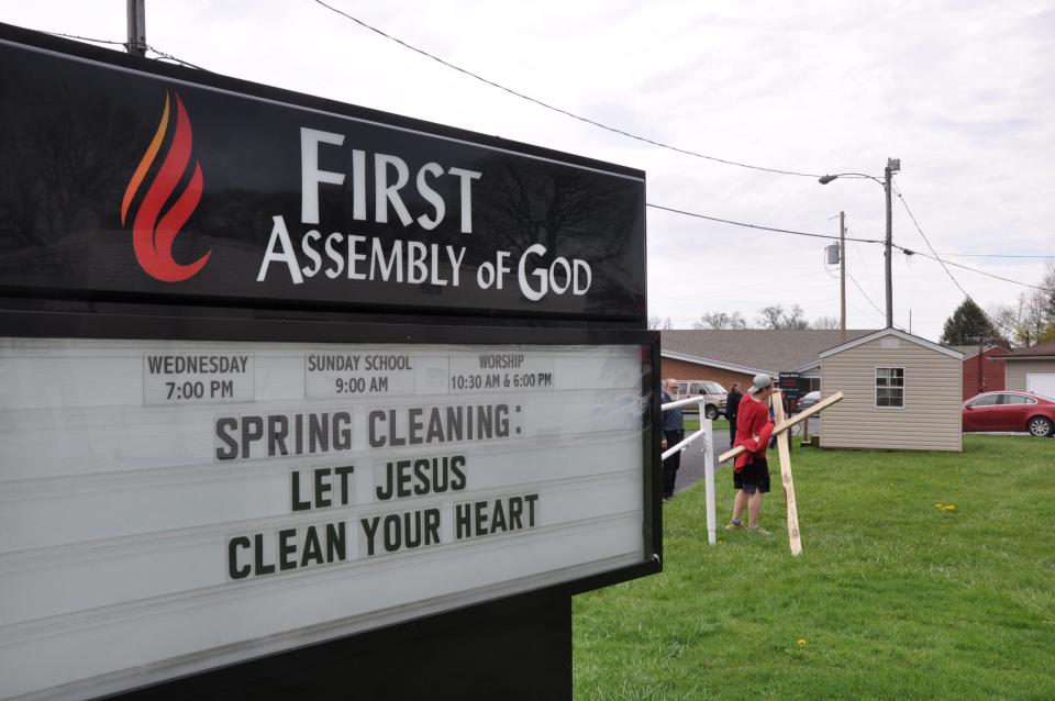 Mason Polinori of Alliance finished his 2.5-mile walk while carrying a cross on Thursday, April 11, 2024, at Alliance First Assembly of God at 45 E. Harrison St.
