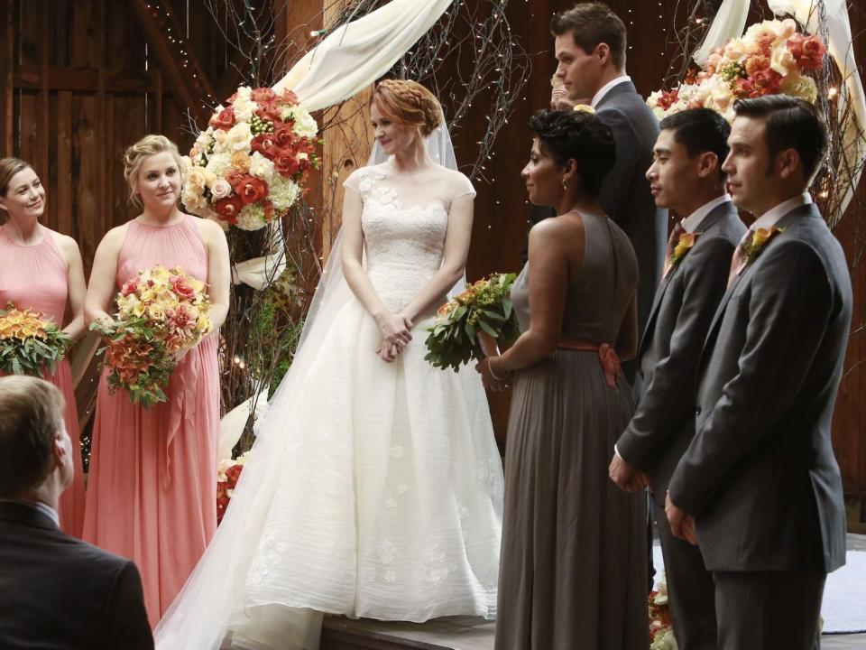 April Kepner stands at her wedding altar on "Greys Anatomy" surrounded by her bridal party.
