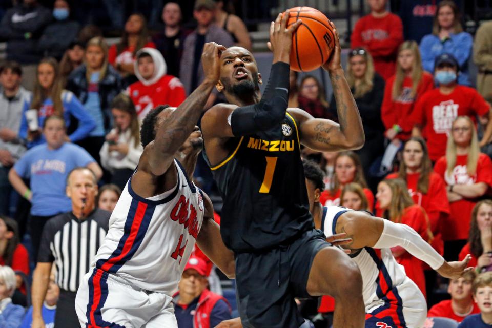 Missouri guard Amari Davis (1) drives to the basket as Mississippi guard Tye Fagan (14) defends during the second half at The Sandy and John Black Pavilion at Ole Miss on Tuesday night in Oxford, Miss.