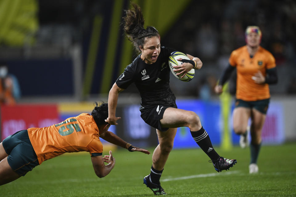 Ruby Tui of New Zealand runs at the defense during the Women's Rugby World Cup pool match between Australia and New Zealand, at Eden Park, Auckland, New Zealand, Saturday, Oct.8. 2022. (Andrew Cornaga/Photosport via AP)