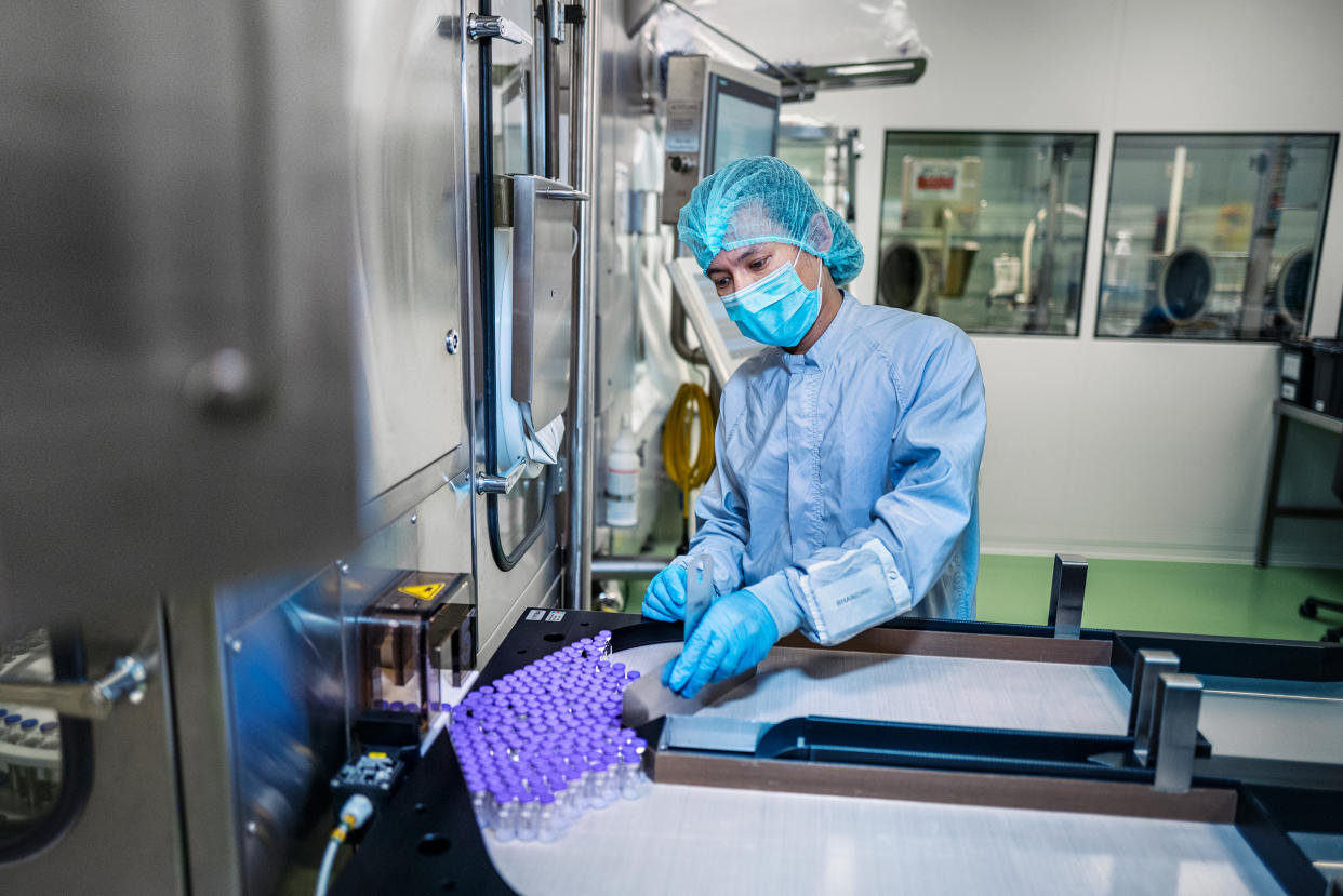 Vials of the Pfizer-BioNTech vaccine at a fill-and-finish facility operated by Baxter International in Halle, Germany, in March. Before they are labeled, the filled vials go through a final inspection.