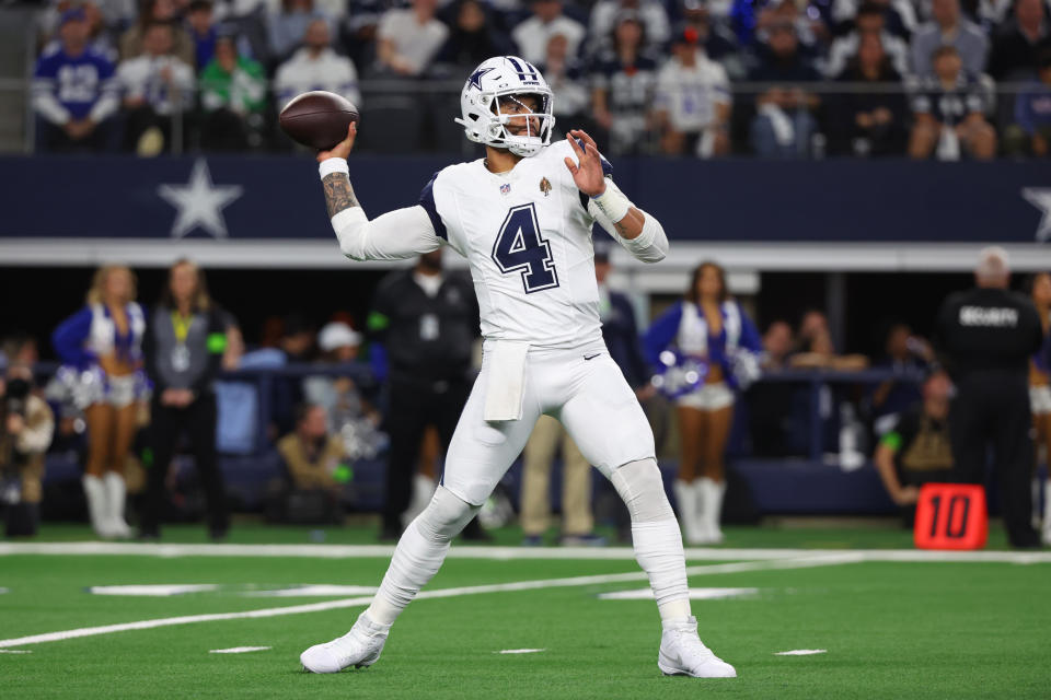 ARLINGTON, TEXAS – DECEMBER 10: <a class="link " href="https://sports.yahoo.com/nfl/players/29369" data-i13n="sec:content-canvas;subsec:anchor_text;elm:context_link" data-ylk="slk:Dak Prescott;sec:content-canvas;subsec:anchor_text;elm:context_link;itc:0">Dak Prescott</a> #4 of the Dallas Cowboys looks to pass during the first quarter against the Philadelphia Eagles at AT&T Stadium on December 10, 2023 in Arlington, Texas. (Photo by Richard Rodriguez/Getty Images)