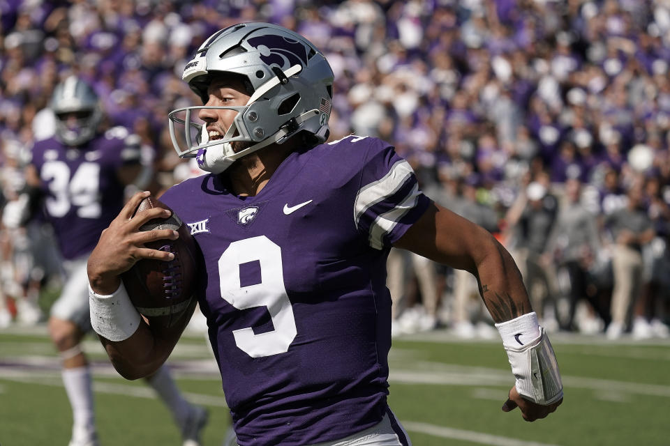 FILE - Kansas State quarterback Adrian Martinez runs the ball during the first half of an NCAA college football game against Texas Tech Saturday, Oct. 1, 2022, in Manhattan, Kan. Martinez was selected top first-year transfer in the Associated Press Big 12 Midseason Awards, Tuesday, Oct. 11, 2022. (AP Photo/Charlie Riedel, File)