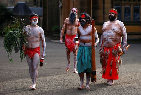 Australian Aboriginal men wearing traditional dress prepare to perform in a welcoming ceremony at Government House in Sydney, Australia, June 28, 2017. REUTERS/David Gray