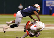 ST. PETERSBURG, FL - JANUARY 21: Defensive back Aaron Henry #7 of the Wisconsin Badgers tackles tight end Emil Igwenagu #44 of the University of Massachuttes Minutemen during the 87th annual East-West Shrine game January 21, 2012 at Tropicana Field in St. Petersburg, Florida. (Photo by Al Messerschmidt/Getty Images)