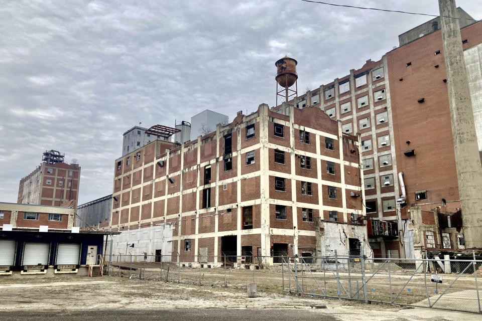 The hulking former Pillsbury Mills plant in Springfield, Ill., is seen, Dec. 30, 2022. It presents a challenge for the citizen nonprofit organization, Moving Pillsbury Forward, but the group has collected $6 million in commitments and has a road map for securing the balance of the $10 million it says it needs to demolish the 500,000 square feet of former factory before redeveloping the 18-acre site. The mill operated under Minneapolis-based Pillsbury and another owner for 71 years but has been vacant nearly a quarter-century. (AP Photo/John O'Connor)