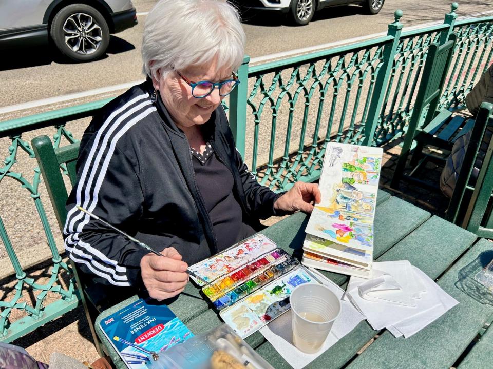 Ann Whitmore, of Holland, participates in a sketch session on Thursday, April 25 in downtown Holland.