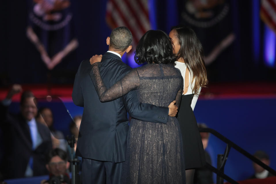 The Obama family embraces on stage following Barack Obama's farewell address.