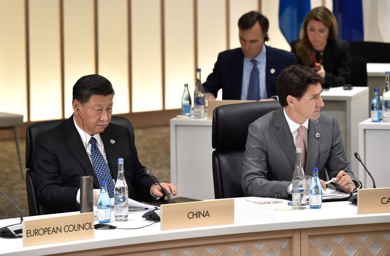 FILE PHOTO: China's President Xi and Canada's Prime Minister Trudeau attend the G20 Summit in Osaka