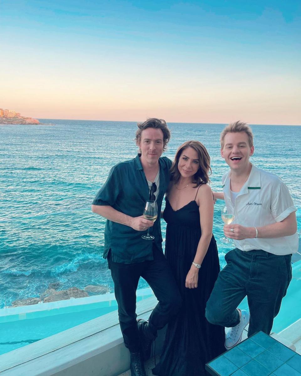 A photo of Nova radio co-stars Tim Blackwell, Kate Ritchie and Joel Creasey posing at the seafront. Photo: Instagram/kateritchieofficial.