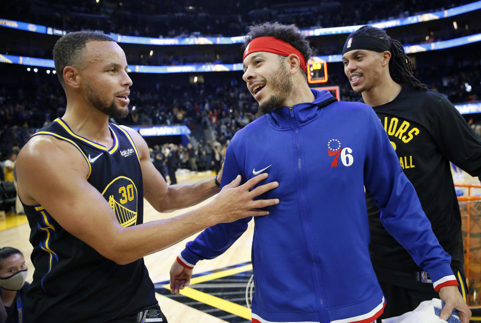 SAN FRANCISCO, CALIFORNIA - NOVEMBER 24: Golden State Warriors' Stephen Curry, #30 is congratulated by his brother Philadelphia 76ers' Seth Curry #31 after the Warriors 116-96 NBA win at the Chase Center in San Francisco, Calif., on Wednesday, Nov. 24, 2021. (Jane Tyska/Digital First Media/East Bay Times via Getty Images)