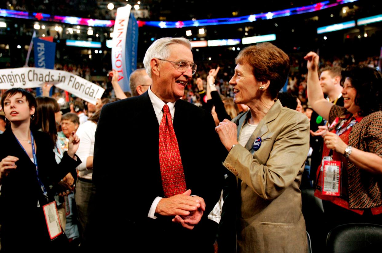 In this Monday, July 26, 2004, file photo, former Vice President Walter Mondale smiles with his wife, Joan, in the Minnesota delegation during the Democratic National Convention at the FleetCenter in Boston. Mondale, a liberal icon who lost the most lopsided presidential election after bluntly telling voters to expect a tax increase if he won, died Monday, April 19, 2021. He was 93.